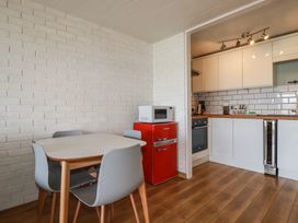 A kitchen with a table and chairs at A5 Bay Apt.