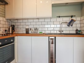 A kitchen with appliances and utensils at A5 Bay Apt.