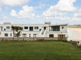 An outdoor view of a building with a lawn at A5 Bay Apt.