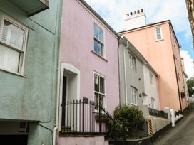 A street view with colorful houses at Tiller Cottage in Dartmouth