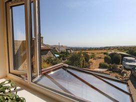 A view from a window overlooking fields at Dunvant in Swanage