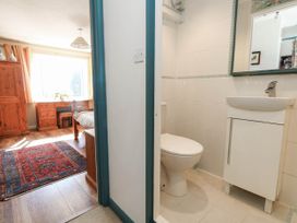 A bathroom with a toilet and sink at Dunvant in Swanage
