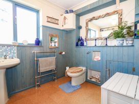 A bathroom with a sink and toilet at Dunvant in Swanage