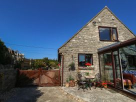 A building with a gate and seating area at Dunvant in Swanage