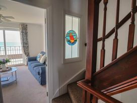A living room with a couch and coffee table at 2 Lyme Mews Seaton