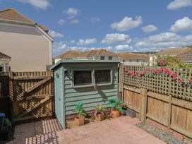 A garden with a shed and plants at 2 Lyme Mews Seaton