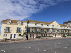A building with multiple balconies and windows at 2 Lyme Mews in Seaton