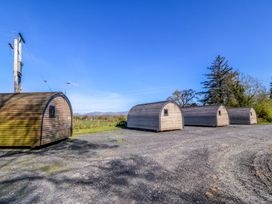 A row of cabins outside at Bron Eifion Pod 2 in Criccieth