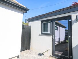 An outdoor area with a door and window at The Annex in Penzance