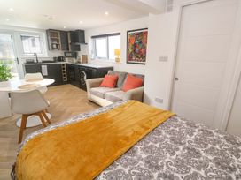 A studio with a bed and kitchen area at The Annex in Penzance