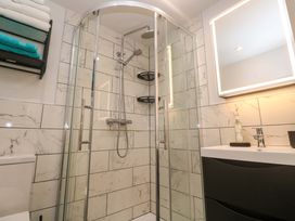 A bathroom with a shower, toilet, and sink at The Annex in Penzance