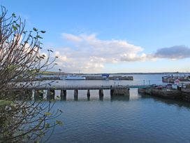 A view of a pier and water with boats at The Annex in Penzance