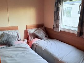 A bedroom with two single beds at Skipsea sands holiday park Driffield
