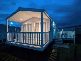 An outdoor area with a deck and steps at 025 Maes Glas in Prestatyn
