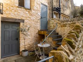 An outdoor area with stairs and a table at Church Alley House Stow-On-The-Wold