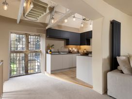 A kitchen with a window and appliances at Church Alley House in Stow-On-The-Wold
