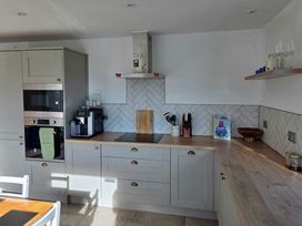 A kitchen with a coffee maker and oven at Pant in Holyhead