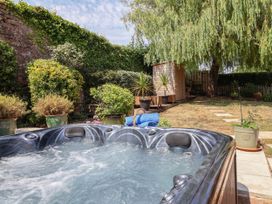 A garden with a hot tub and a shed at Pete's Place in Taunton