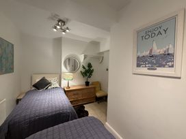 A bedroom with two beds and a dresser at Dart Views in Dartmouth