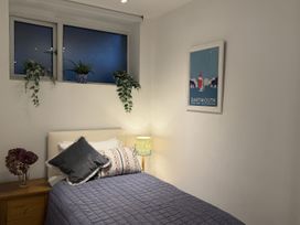 A bedroom with a bed and lamp at Dart Views in Dartmouth
