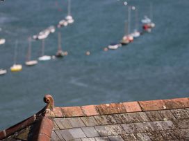 A view of boats on water with a roof in the foreground at Dart Views in Dartmouth