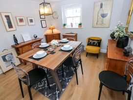 A dining room with table and chairs at Newgale Cottage in Haverfordwest
