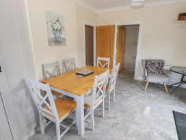 A dining room with a table and chairs at River House