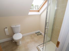 A bathroom with a toilet and shower at River House