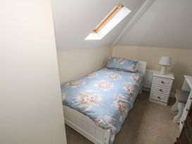 A bedroom with a bed and nightstand at River House