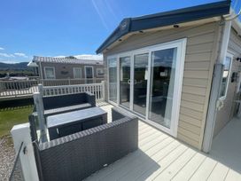 An outdoor area with terrace furniture at Caravan i35 in Conwy