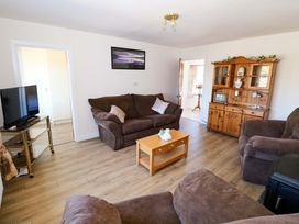 A living room with a sofa and coffee table at Cahir Cottage in Ballinrobe, County Mayo