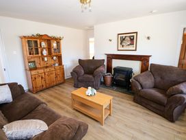 A living room with sofas and a coffee table at Cahir Cottage, Ballinrobe, County Mayo