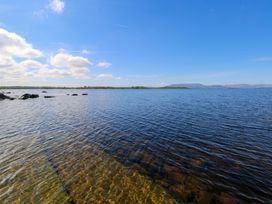 A view of water and rocks at Cahir Cottage in Ballinrobe, County Mayo