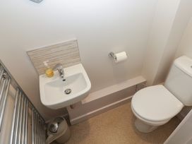 A bathroom with a sink and toilet at The Gallops in Barry