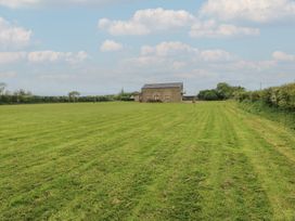 A house surrounded by a field at The Gallops in Barry