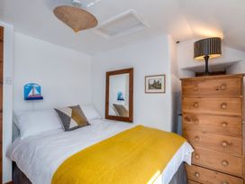 A bedroom with a bed and dresser at Trehaverock Cottage St. Endellion near Port Isaac