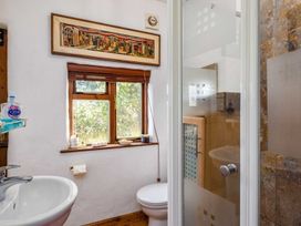 A bathroom with a sink, shower, and toilet at Trehaverock Cottage in St. Endellion near Port Isaac