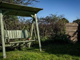 A swing set in a garden at Trehaverock Cottage St. Endellion near Port Isaac