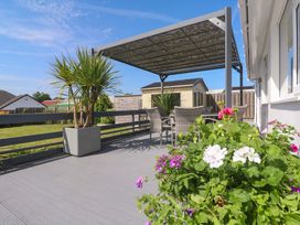 An outdoor area with a canopy and seating at Agan Paradhis in Quintrell Downs