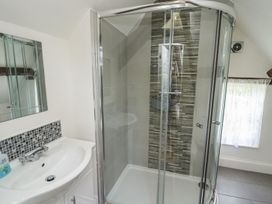 A bathroom with a sink and shower at Reighton House in Filey