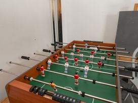 A foosball table with foosball players at Reighton House in Reighton near Filey