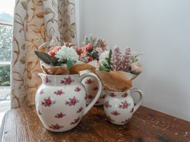 A pitcher with flowers on a table at Reighton House in Reighton near Filey