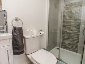 A bathroom with a sink, toilet, and shower at Reighton House in Reighton near Filey