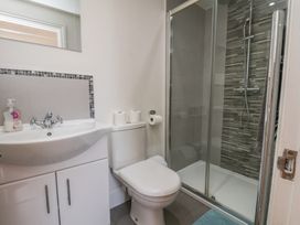 A bathroom with a shower and sink at Reighton House in Reighton near Filey