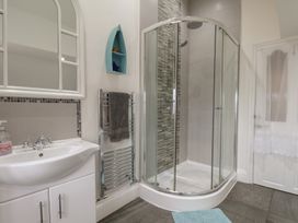 A bathroom with a shower and sink at Reighton House in Reighton near Filey