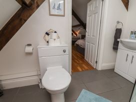 A bathroom with a toilet and sink at Reighton House in Reighton near Filey
