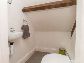 A bathroom with a toilet and sink at Reighton House in Reighton near Filey
