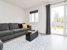 A living room with a sofa and coffee table at 24 Higher Gorse Road in Roughton