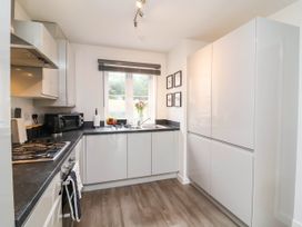 A kitchen with a sink and cabinets at 24 Higher Gorse Road in Roughton
