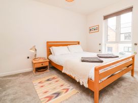 A bedroom with a bed and nightstand at 24 Higher Gorse Road Roughton